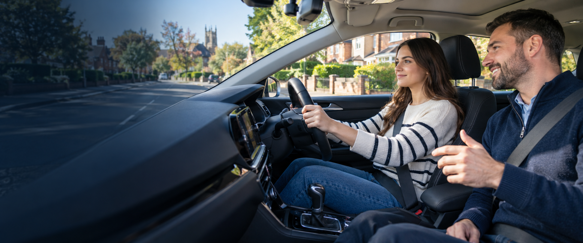 A learner having an automatic driving lesson with an instructor